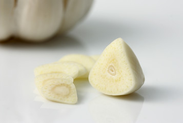 garlic slices isolated on white background