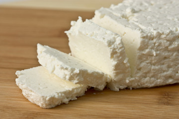 Fototapeta na wymiar fresh cheese on wooden board