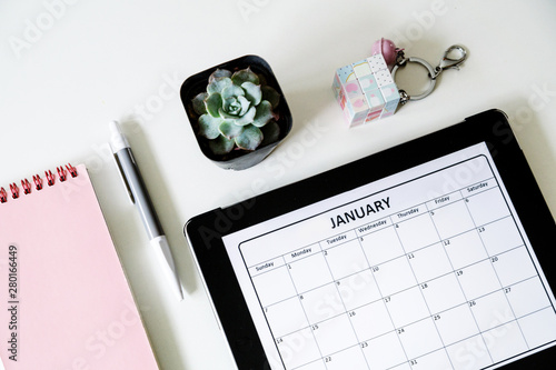 Flat Lay Desk With Notebook Succulent Flower Pen And Calendar