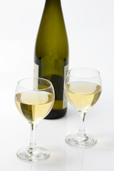 glass of white wine and bottle
