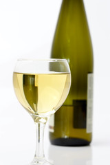 glass of white wine and bottle