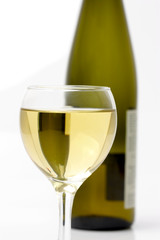 glass of white wine and bottle