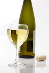 glass of white wine and bottle
