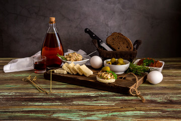 Varied, fresh, tasty snacks and aperitif on wooden table close-up