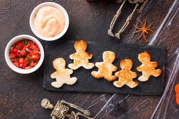 Bread in shape of men and sauces