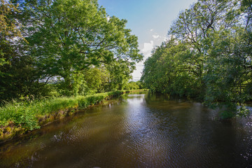 Fototapeta na wymiar View of a British canal in rural setting