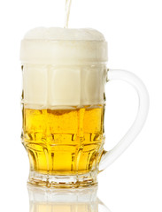 glass of beer with foam isolated on white