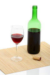 bottle and glass of red wine isolated with clipping path
