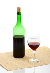 bottle and glass of red wine isolated with clipping path