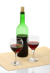 bottle and glass of red wine isolated with clipping path
