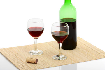 bottle and glass of red wine isolated with clipping path