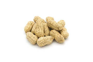 Stacked fresh shelled peanuts close-up on a white background