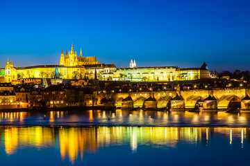 Fototapeta na wymiar View of Charles Bridge, Prague Castle and Vltava river in Prague, Czech Republic during blue hour twilight sunset