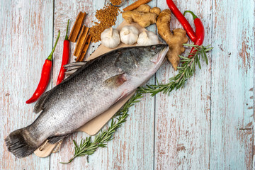Fresh Sea Bass on wooden table