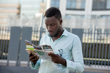 young man walking in the city and talking cellphone.