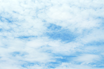 white clouds and blue sky background.