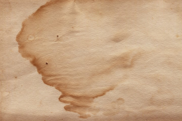 Vintage and old looking paper background. Retro cardboard texture. Grunge paper for drawing. Ancient book page.