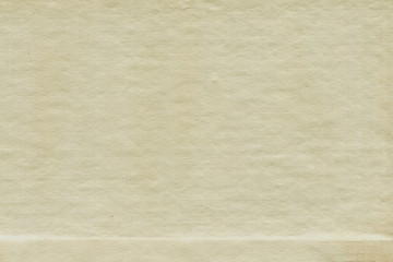 Vintage and old looking paper background. Retro cardboard texture. Grunge paper for drawing. Ancient book page.