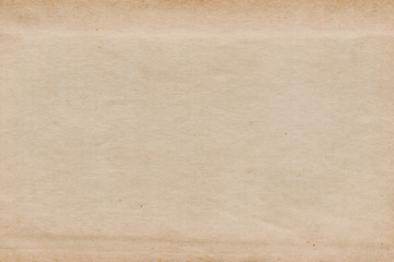 Vintage and old looking paper background. Retro cardboard texture. Grunge paper for drawing. Ancient book page.
