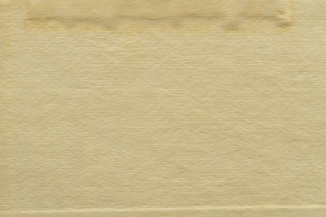 Vintage and old looking paper background. Retro cardboard texture. Grunge paper for drawing. Ancient book page.