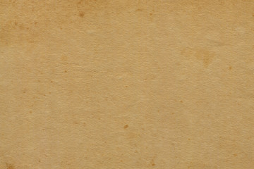 Vintage and old looking paper background. Retro cardboard texture. Grunge paper for drawing. Ancient book page.
