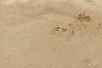 Vintage and old looking paper background. Retro cardboard texture. Grunge paper for drawing. Ancient book page.