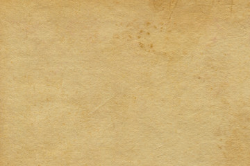 Vintage and old looking paper background. Retro cardboard texture. Grunge paper for drawing. Ancient book page.