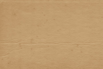 Vintage and old looking paper background. Retro cardboard texture. Grunge paper for drawing. Ancient book page.