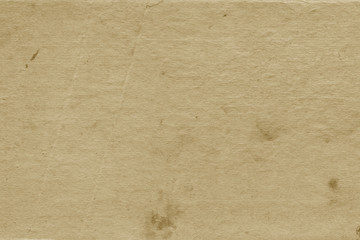 Vintage and old looking paper background. Retro cardboard texture. Grunge paper for drawing. Ancient book page.
