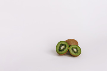Cut kiwi on a white background with a place for text