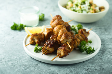 Homemade chicken skewers with fresh parsley