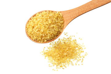 dry bulgur wheat in wooden spoon isolated on white background