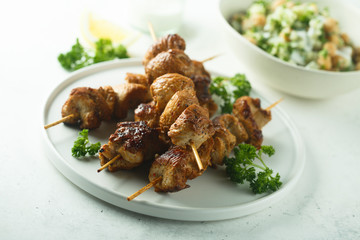 Homemade chicken skewers with fresh parsley
