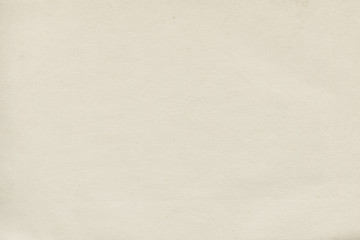 Vintage and old looking paper background. Retro cardboard texture. Grunge paper for drawing. Ancient book page.