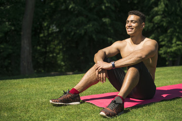 Athletic man practicing yoga outdoor