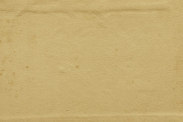 Vintage and old looking paper background. Retro cardboard texture. Grunge paper for drawing. Ancient book page.