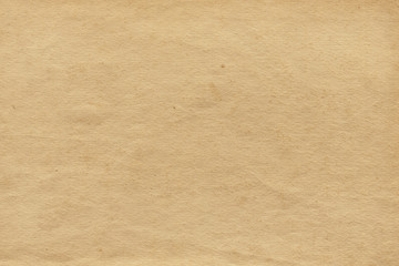 Vintage and old looking paper background. Retro cardboard texture. Grunge paper for drawing. Ancient book page.