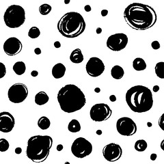 Abstract vector seamless pattern. Dots background with round brush strokes. Monochrome hand drawn pattern.