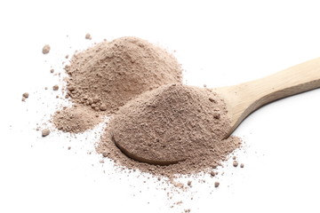 Milled chocolate powder with wooden spoon isolated on white background