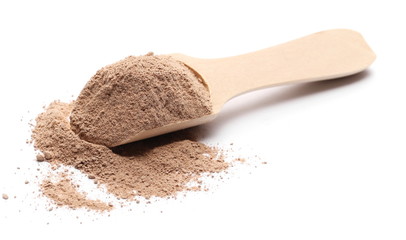 Milled chocolate powder with wooden spoon isolated on white background