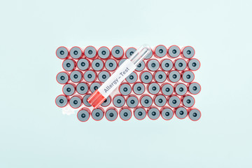 top view of empty test tube with allergy test lettering isolated on blue