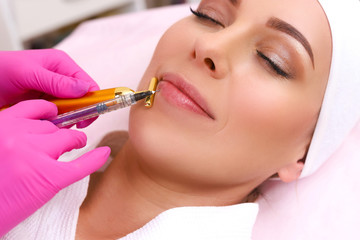 Rejuvenating facial injections.