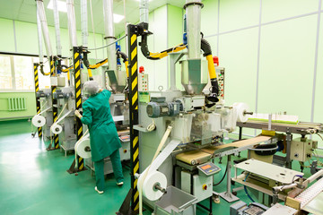 Factory and industrial concept. Worker with technological equipment at factory