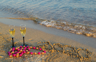 Glasses of champagne on the beach ,new year 2020. Christmas vacation at sea.