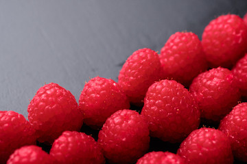 Close-up of delicious fresh and sweet red raspberries.