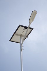 close up lamp pole and solar panel with a battery included