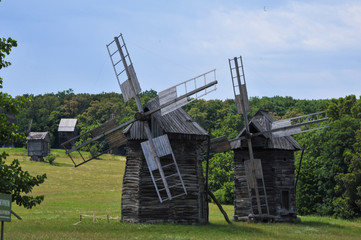 Plakat Windmills. Ukraine. Ukrainian traditions. Pirogovo. Open-air museum. Blue sky. Summer. Good mood