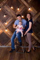 Obraz na płótnie Canvas Happy Young Caucasian Family Posing in Studio