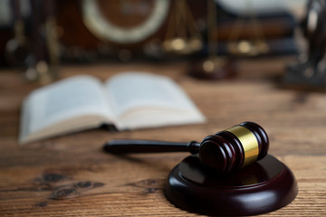 The law concept background. Mallet of the judge and legal code © zolnierek