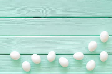 Farm products with eggs on mint green wooden background top view mock up